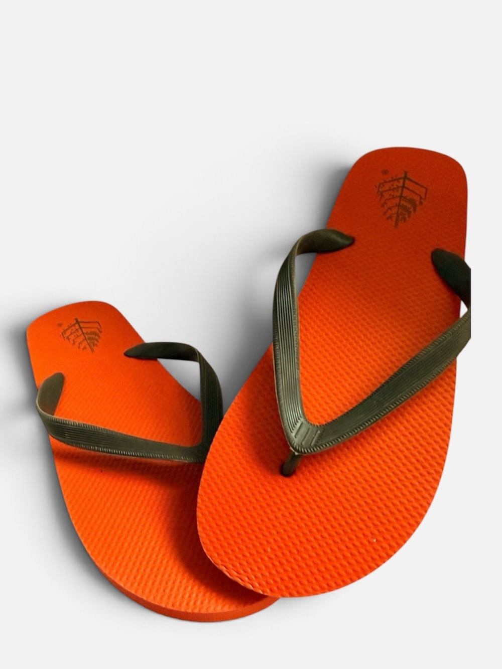 Four Seasons Resort Orange Flip Flop Sandals with Black Straps